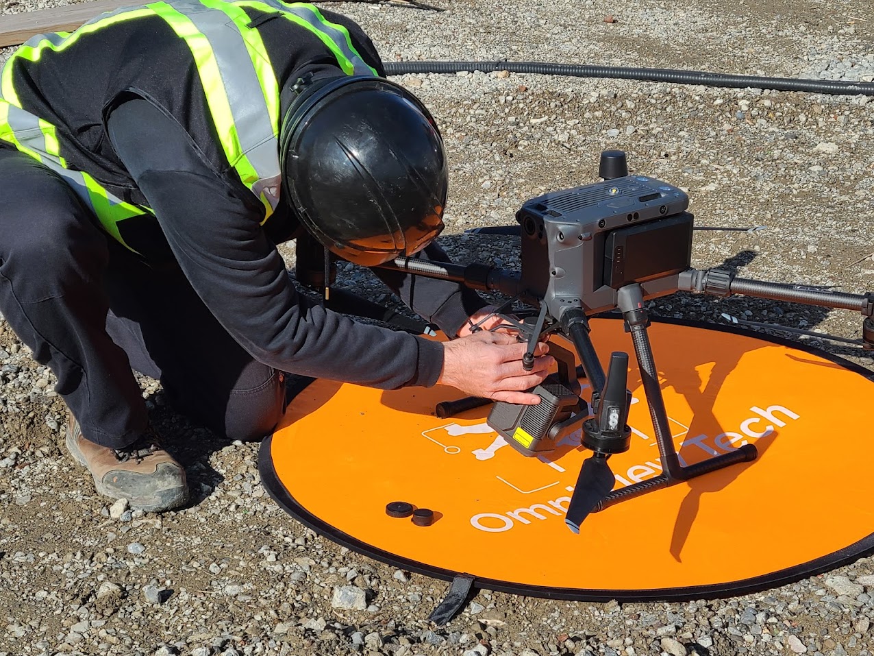 Michael Brown preparing a DJI Matrice 300 drone on a landing pad